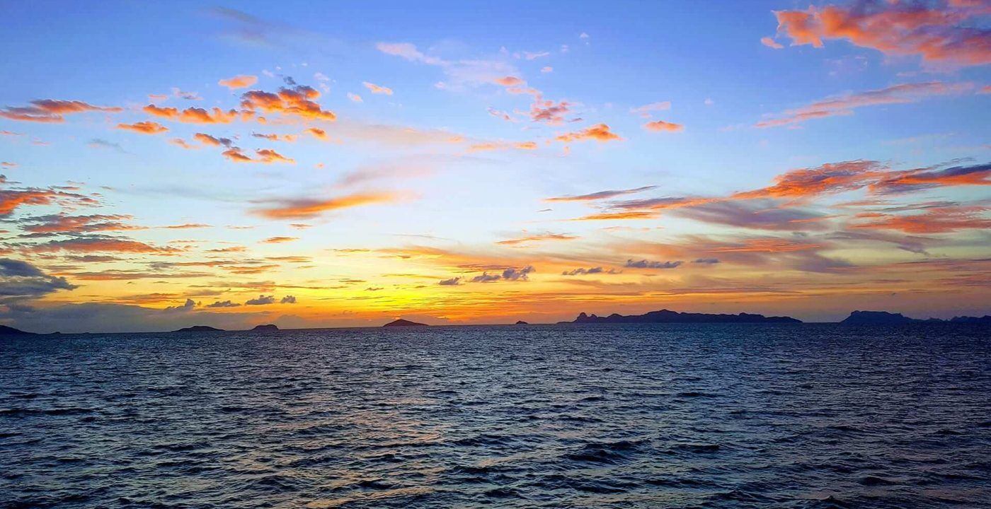 Sunset among mountains taken from the sea